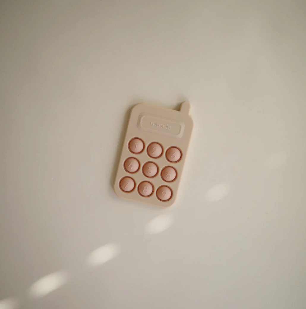 MUSHIE PHONE PRESS TOY - BLUSH
