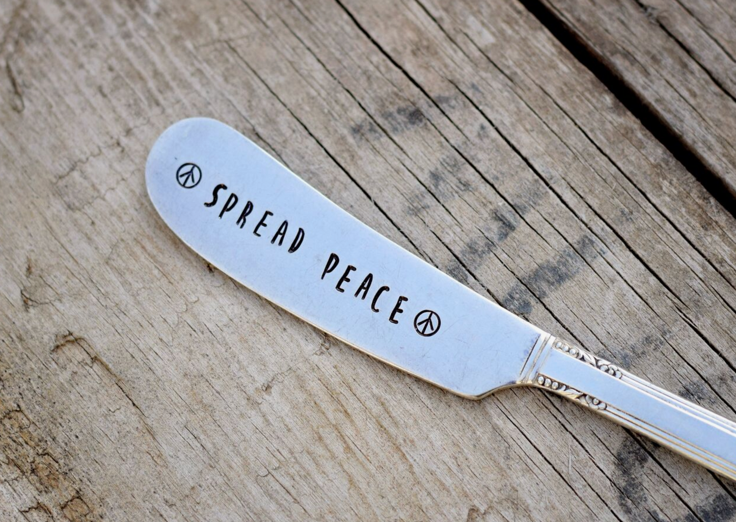 SPREAD PEACE BUTTER KNIFE