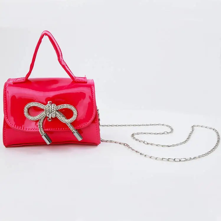 PATENT SILVER BOW PURSE